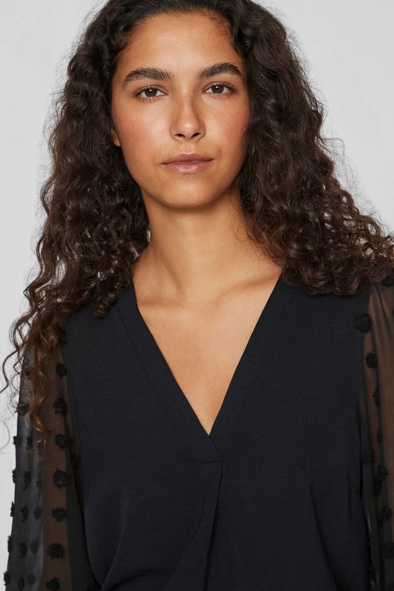 Blusa com plumeti nas mangas
