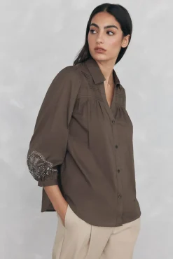 Blusa lisa larga bordada