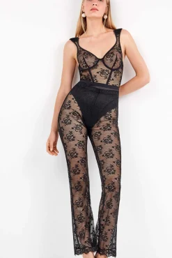 Calça comprida elástica delicada de renda floral transparente