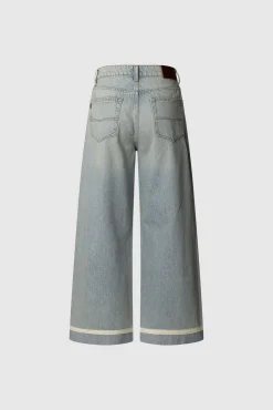 Calça denim de perna larga com detalhe na baixo