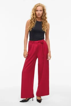 Calça social de pernas largas com cinto de flores