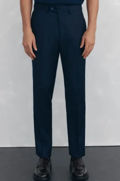 Calças estilo olho de pássaro, com modelagem slim fit e bielástica