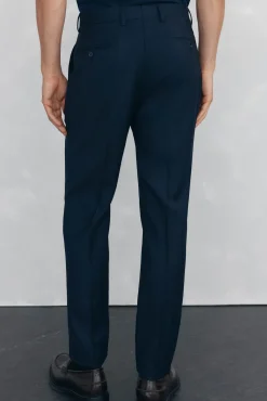 Calças estilo olho de pássaro, com modelagem slim fit e bielástica