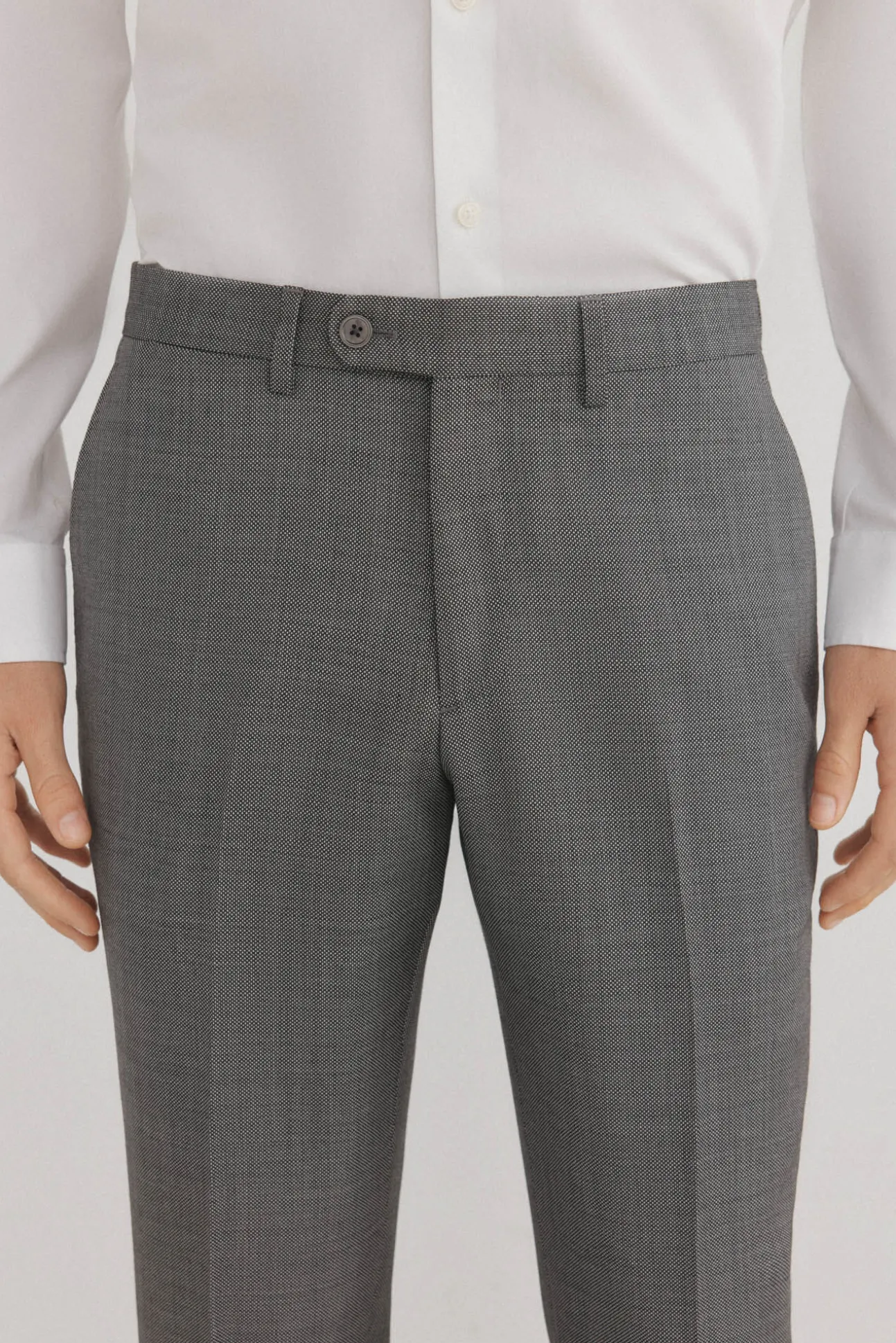 Calças estilo olho de pássaro, com modelagem slim fit e bielástica