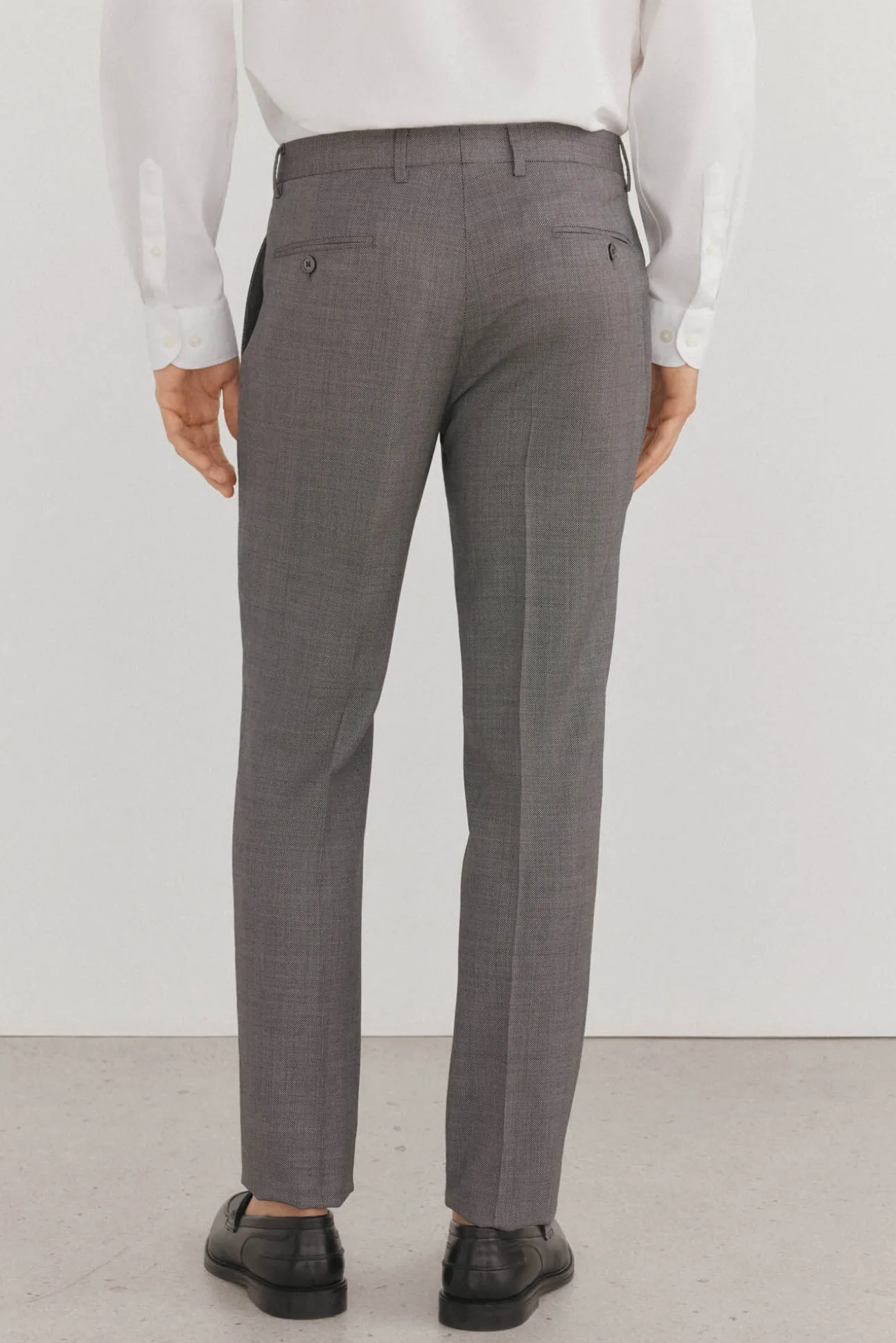 Calças estilo olho de pássaro, com modelagem slim fit e bielástica