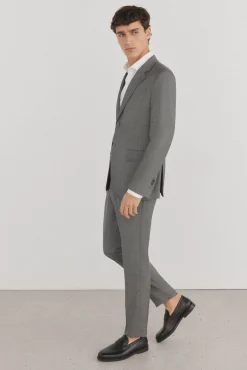 Calças estilo olho de pássaro, com modelagem slim fit e bielástica