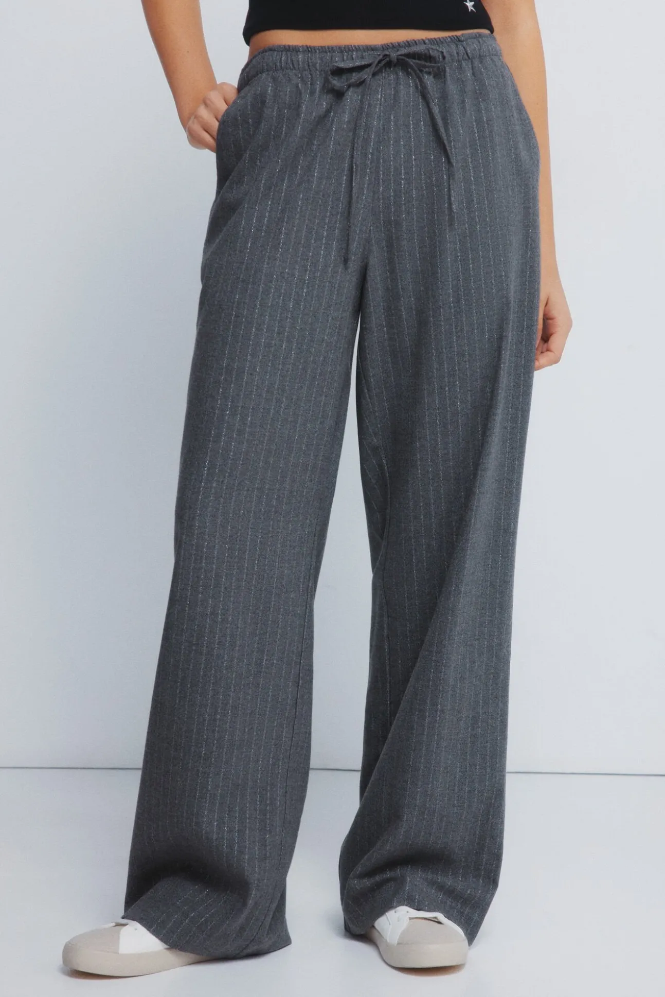 Calças jogger riscas de lurex