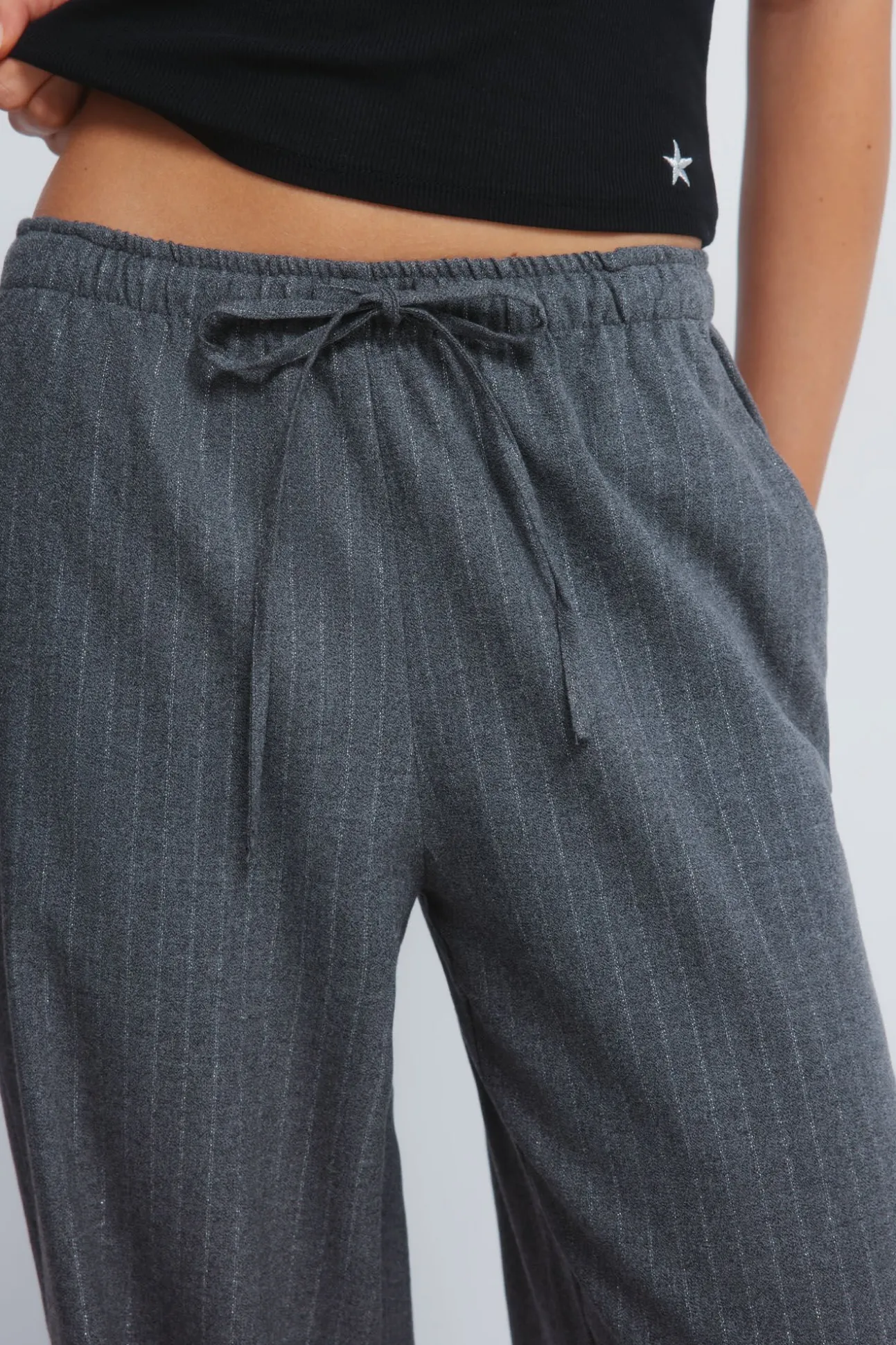 Calças jogger riscas de lurex