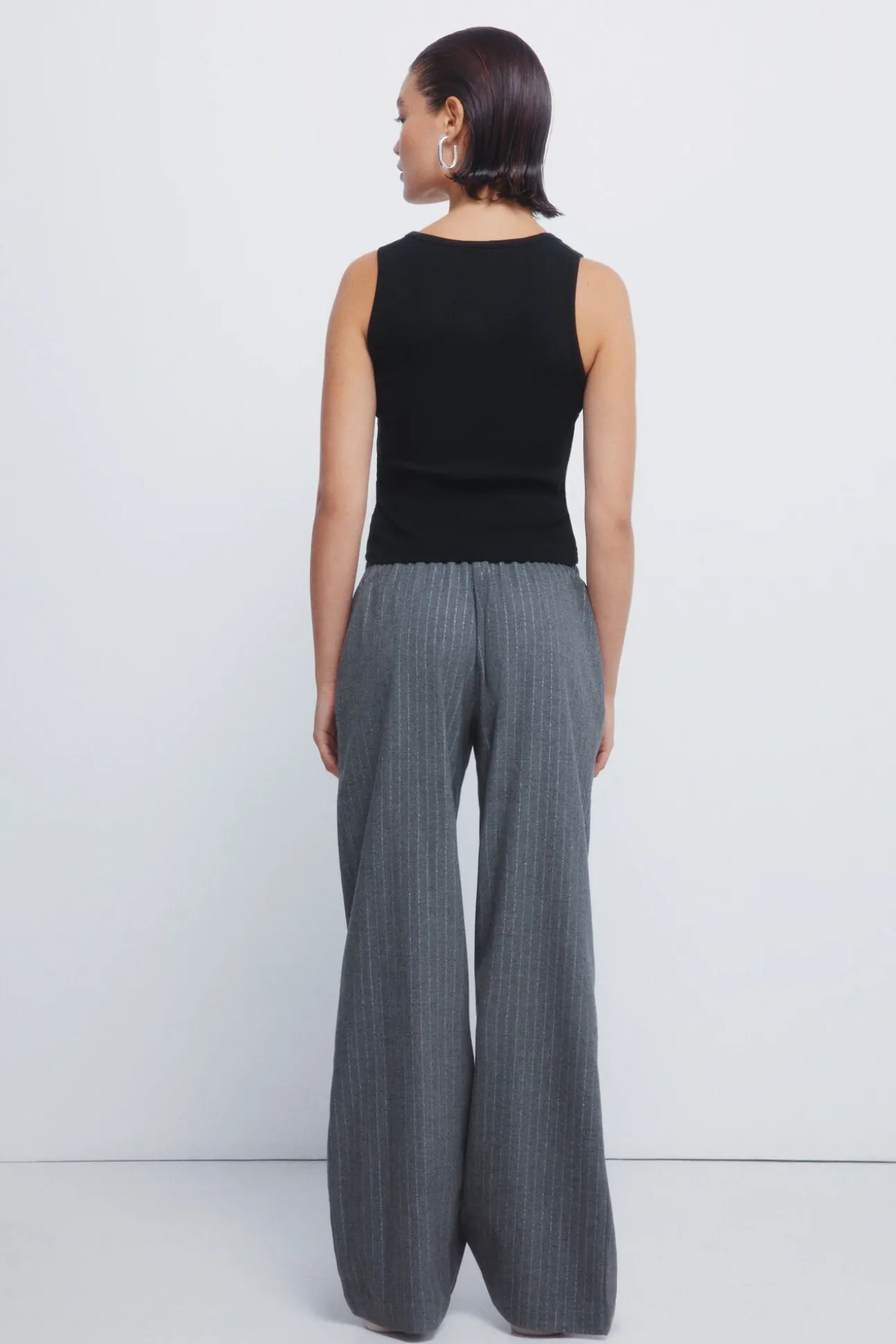 Calças jogger riscas de lurex