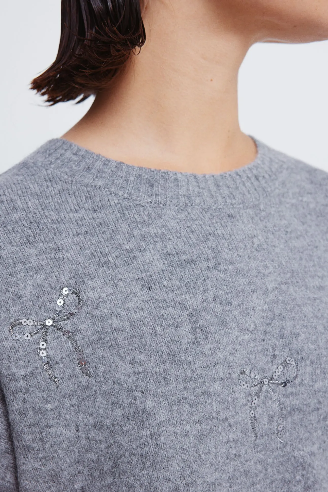 Camisola com laços de lantejoulas