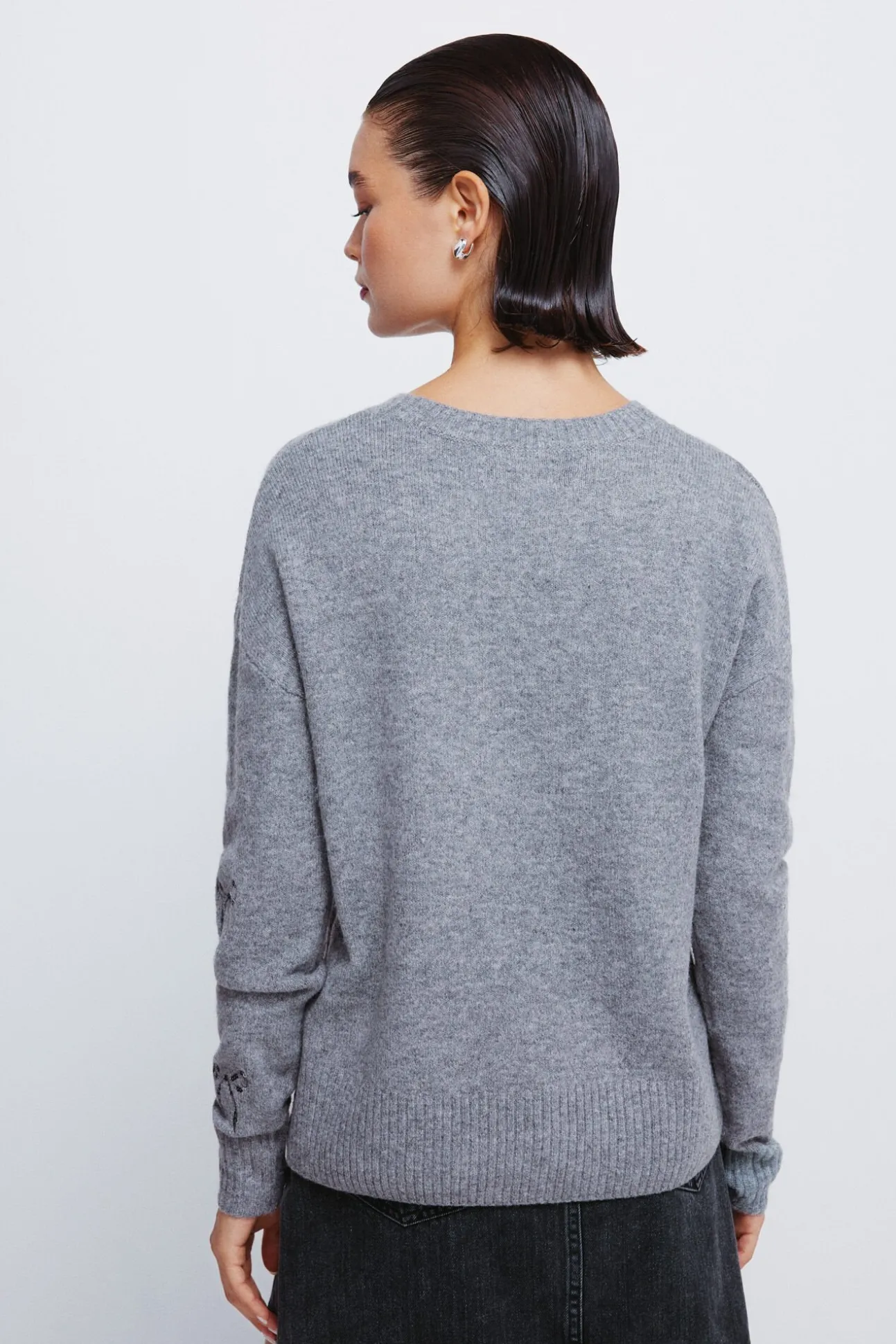 Camisola com laços de lantejoulas