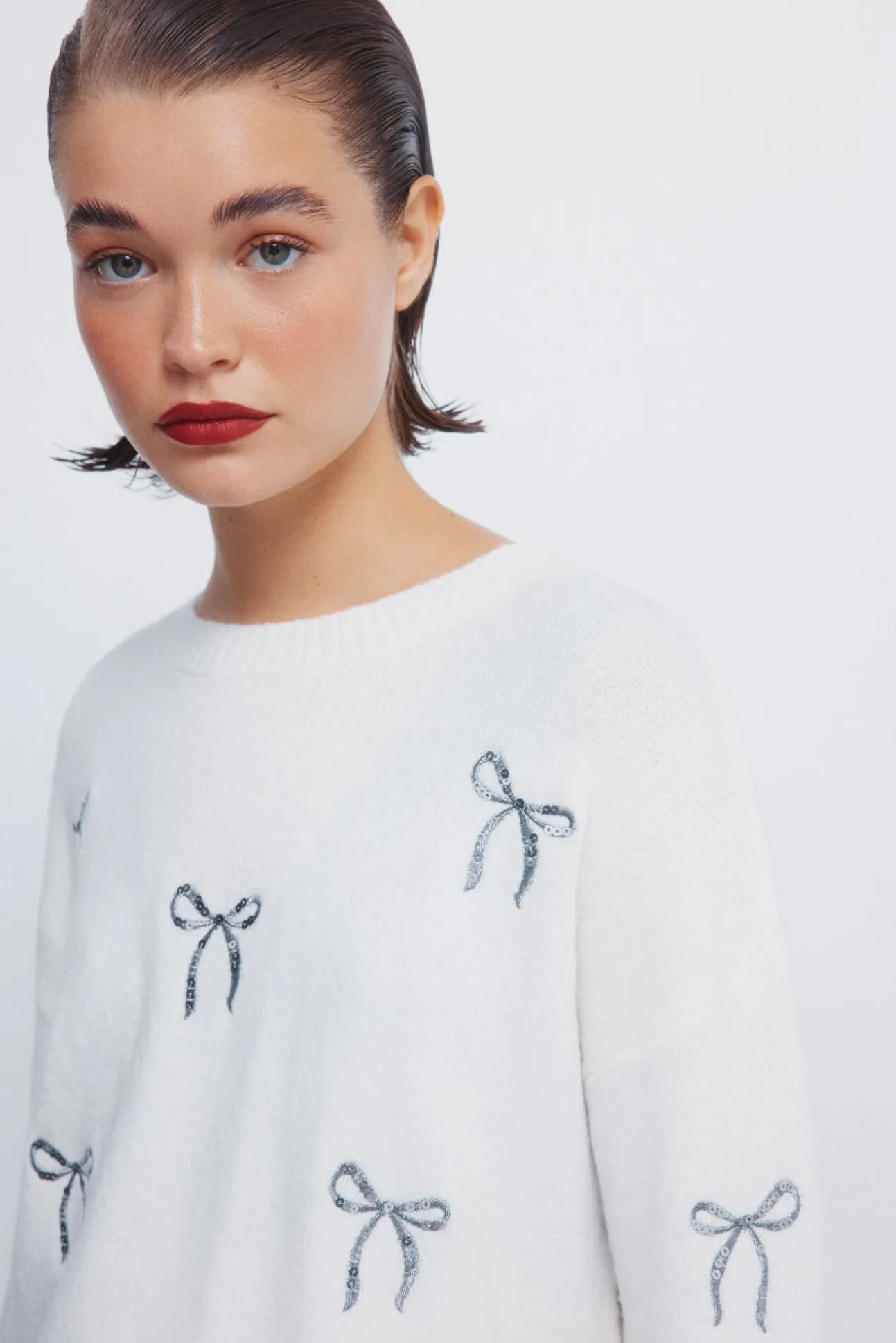 Camisola com laços de lantejoulas