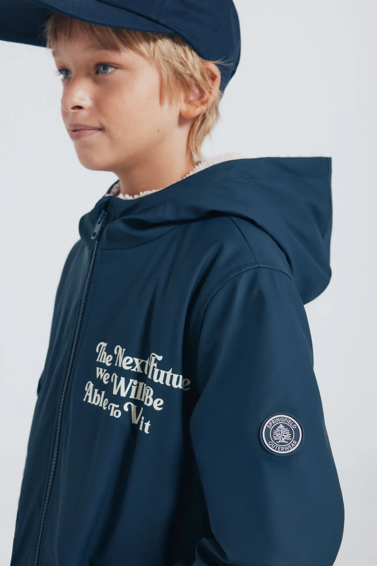 Parka azul marinho com frase para criança