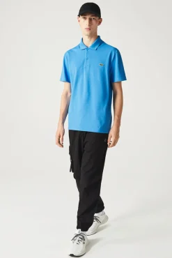 Polo com bordado de crocodilo costurado