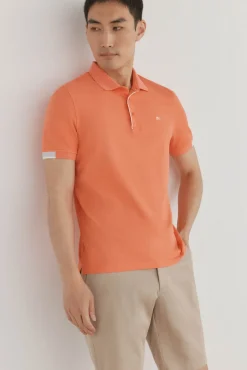Polo com punhos contrastantes