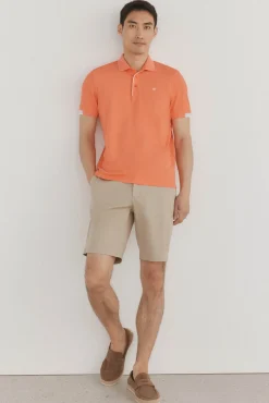 Polo com punhos contrastantes