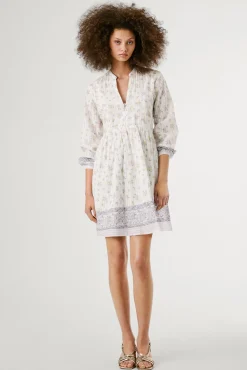 Vestido curto de manga comprida com estampado floral.